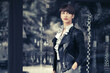 Young fashion woman in leather jacket with pixie hair style