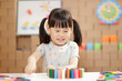 © M-image - young girl play number sticks fine motor skill game for homeschooling