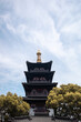 Traditional Chinese pagoda over trees in Suzhou, China