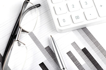 Poster - Graphs , pen, glasses and Calculator. Business concept