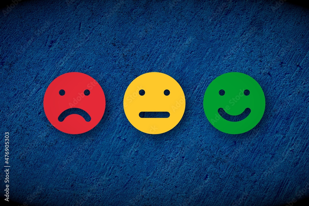 Red Angry Yellow red angry yellow neutral and green happy faces over blue concrete wall ...