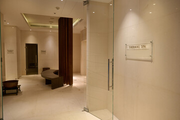 View of luxurious interior of a hall in the bath and sauna at wellness spa center with marble walls