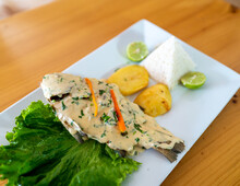 Menier Fish With Golden Potatoes, Lettuce And Rice. Peruvian Food.