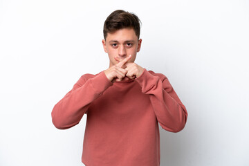 Young handsome Brazilian man isolated on white background showing a sign of silence gesture