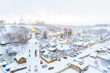 Aerial drone view of ancient russian town Ples on the Volga river in winter with snow, Ivanovo region