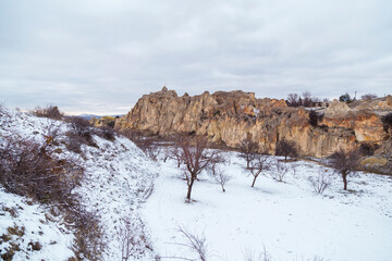 Volcanic rock landcsape of Fairy tale chimneys in Cappadocia with blue sky on background in Goreme, Nevsehir, Turkey