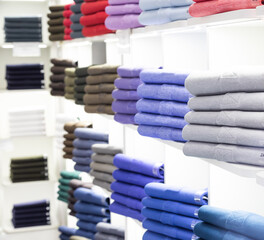 polo t-shirt store interior. shop shelves with colored fashion cotton shirt