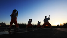 People Are Practicing Taijiquan On The Wooden Platform Of The Park, North China