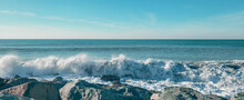 Seascape Of The Black Sea Beach. Sea Waves Crash And Splash On Rocks. View Of The Sea, Ocean. Natural Soft Blue Background. View Of The Sea, Ocean. Batumi, Georgia