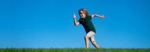 Banner With Spring Kids Portrait. Happy Kids Playing And Running On Grass Outdoors In Summer Park. Active Kids Healthy Outdoor. Fun Activity.