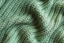 Beautiful Pale Green Knitted Fabric As Background, Top View