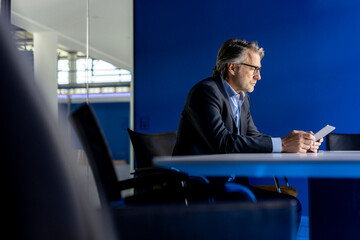 Businessman using tablet PC at workplace