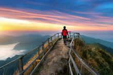 Tourist Walking On Phu Chi Dao Mountain At Sunrise In Chiang Rai Province, Thailand.