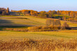 Autumn panoramic view of hills with fields and meadows with mixed forest surrounding Zagorzyce village south Sedziszow Malopolski town in Podkarpacie region of Lesser Poland
