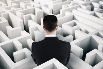 Aufkleber - Back view of businessman in suit looking at white maze. Solution and challenege concept.