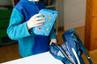 © Irina Schmidt - School kid boy getting ready in the morning for school. Healthy child filling satchel with books, pens, folders and school stuff. Preaparation, routine concept.