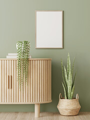 Aufkleber - Poster mockup with vertical wooden frame hanging on olive green wall near curved slat sideboard with trendy green plants and basket. 3D rendering, illustration