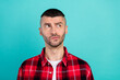 © deagreez - Photo of young minded thoughtful man look empty space think brainstorm serious isolated on teal color background
