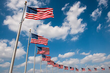 USA, Washington D.C., Row Of American Flags Around Washington Monument