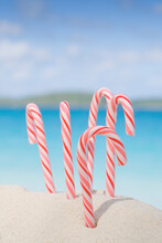 Christmas Candy Canes On Tropical Beach