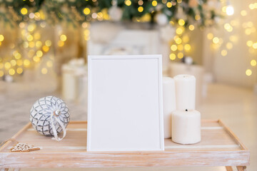 Wall Mural - Christmas photo frame mock up template with decoration on wooden table.