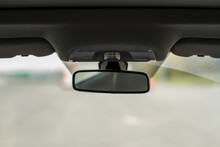 The rearview mirror inside the car.