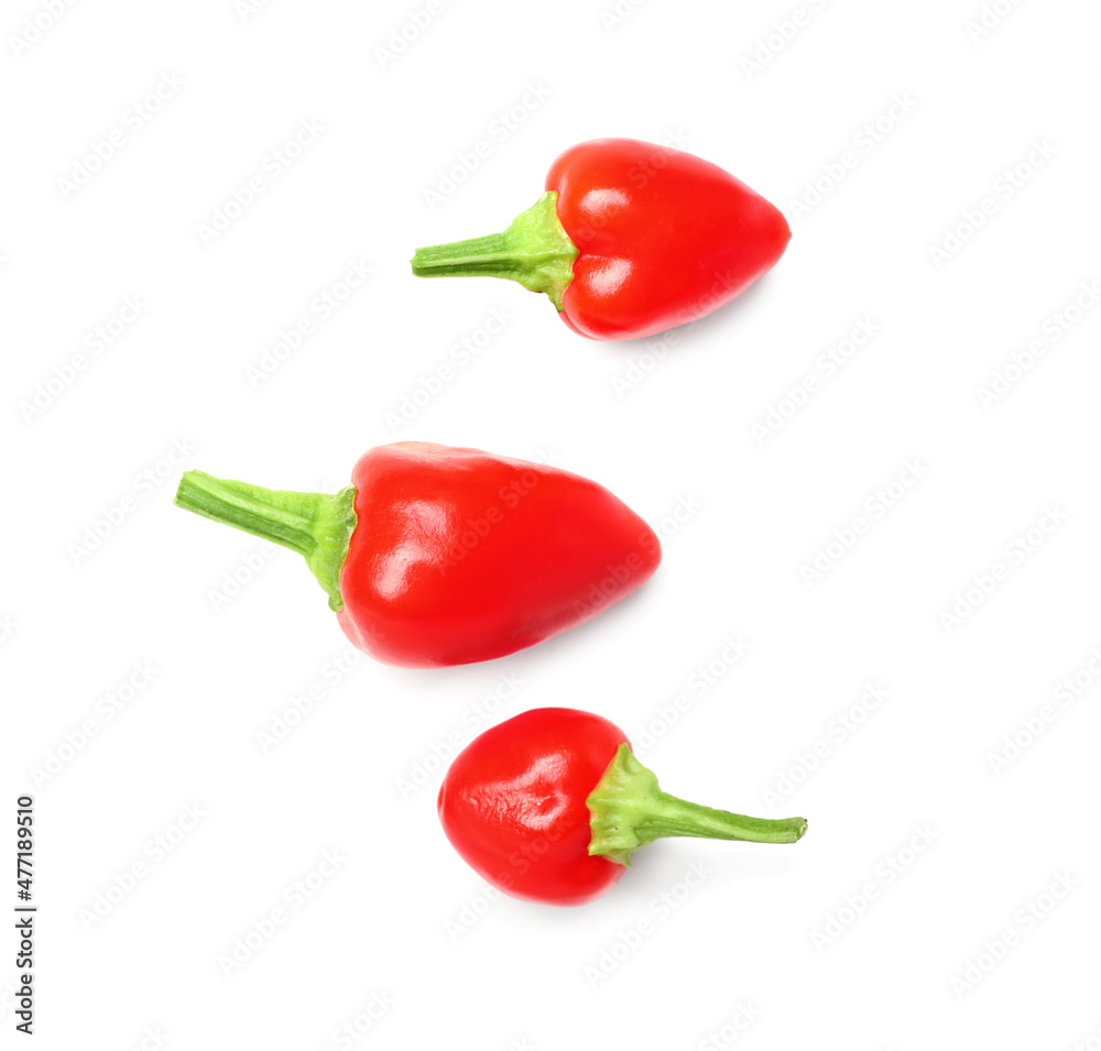 Fresh raw red peppers on white background