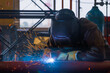 © Danil Evskiy - Welding of metal structures by semi-automatic arc welding. MIG welding.