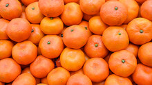 Fresh Mandarins On Fruit Market, Close Up. Boxes Full Of Ripe Mandarin Oranges For Sale In Supermarket. Fresh Fruit Display In Shop. Juicy Mandarin Orange At The Greengrocer's Stall. 