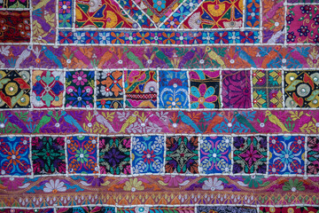 Wall Mural - Detail old colorful patchwork carpet in India. Close up