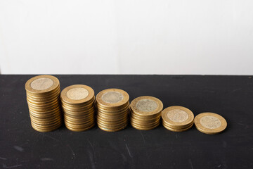 Wall Mural - stack of 10 mexican peso coins on white background