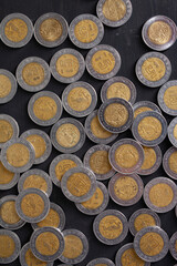 Wall Mural - 5 mexican peso coins on a table