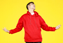 Young Asian Teenager In Red Jacket With Hood Express Fury And Delight As Confident To Win Hard Youth Games And Challenge His Opponents Fearlessly To Fight In Sport Gym