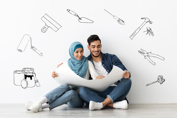 Wall Mural - Smiling middle-eastern family planning new house repairing