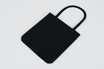 Poster - Top view and close up of clean black shopper on white background. Mock up, advertisement, 3D Rendering.