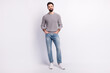 © Tetiana - Full size photo of handsome man confident wear casual clothes arms in pocket isolated on grey color background