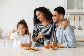 Wall Mural - Loving middle-eastern family enjoying healthy breakfast together