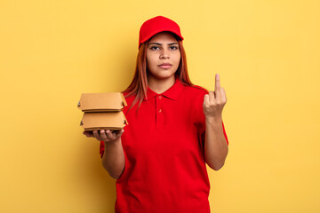 hispanic woman feeling angry, annoyed, rebellious and aggressive. take away deliver concept