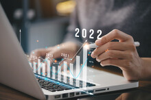 Businessman Plan Business Growth And Financial, Increase Of Positive Indicators In The Year 2022 To Increase Business Growth And An Increase For Growing Up Business .