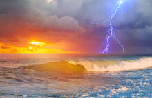 Amazing Sunset Over The Stormy Sea Thunder And Lightning In The Background