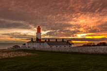 The Red And White Striped, 23 Meter Tall,  Souter Lighthouse And The Leas In Marsden, South Shields, England, As The Sun Rises
