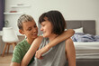 © Svitlana - Young lesbian couple resting and hugging at home
