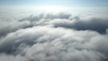 Aerial Shot Of Flying Over A Layer Of Soft Clouds At Dawn