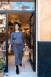 © ADDICTIVE STOCK - Pregnant female with basket in hand leaving shop