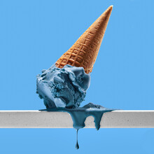 Delicious Gelato On Metal Railing Against Blue Background