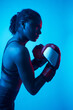 © ADDICTIVE STOCK - African American female boxer during workout in studio