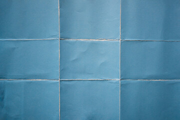 Wall Mural - Blue paper folded in nine fraction background
