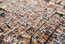 Aerial View Of Houses With Orange Rooftops Tightly Built In Conil De La Frontera, Spain.
