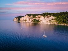 Aerial View Of Two Sailboats Mooring Close To Mons Klint During Golden Hour, Denmark.