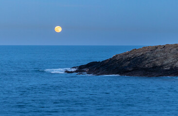 Wall Mural - Full moon on the coast of Galicia, with lighthouse, natural rock arches, etc!